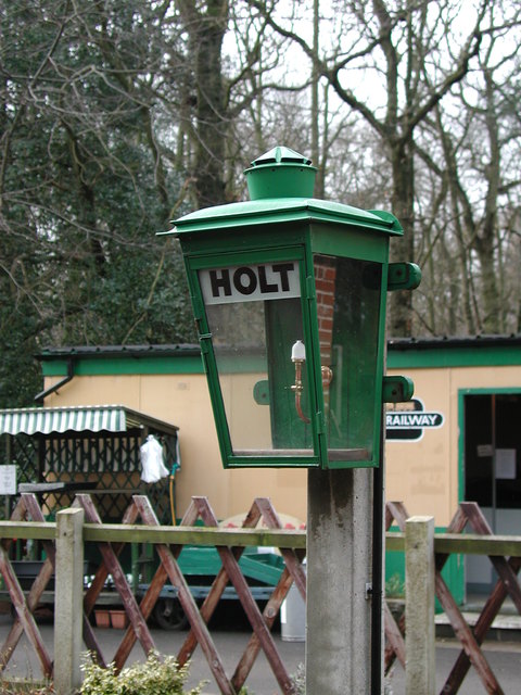 A 'gas lamp' now powered by electricity on the platform at Holt
