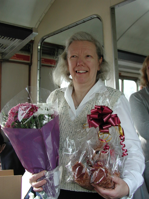 Chris Fisher with some of her farewell gifts. She named the bear Maty
