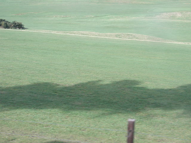 Shadow of the steam from the engine on Royal Sheringham golf course
