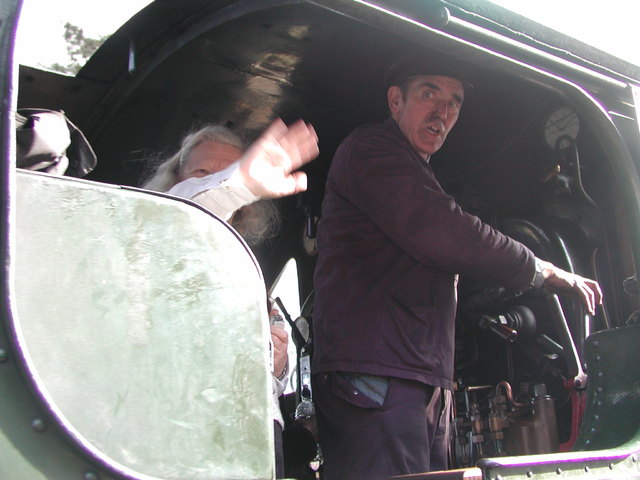 Chris Fisher giving a wave as the train driver sets off. She was allowed to pull the steam whistle and move the regulator on engine 5619
