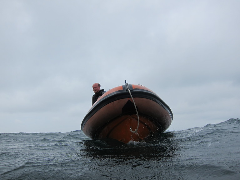 Jim Darby on ISAC's RIB watching out for divers to surface, Lulworth
