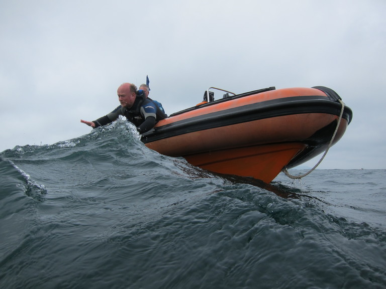 Jim Darby looks worried as he tries to 'calm the sea' for recovering divers. Lulworth
