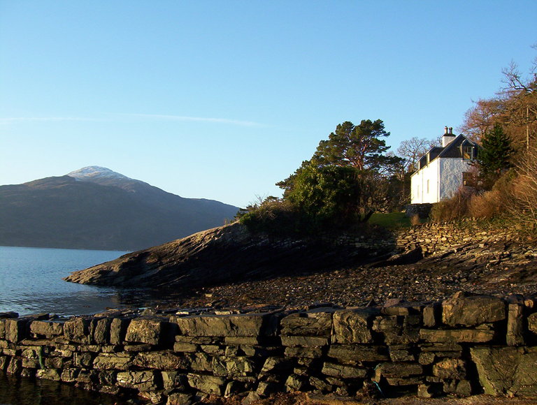 Craggan cottage from the slipway in the morning sun
