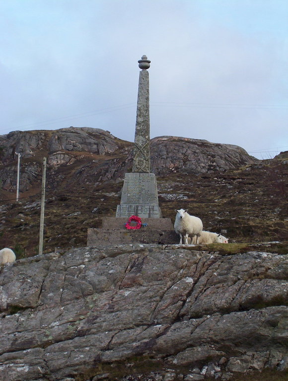 Sheep at a war memorial dedicated to the fallen soldiers of the First and Second World wars, Shieldaig 
