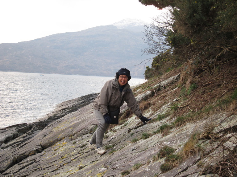 Clambering over boulders by the shore of Lochalsh just outside Craggan cottage
