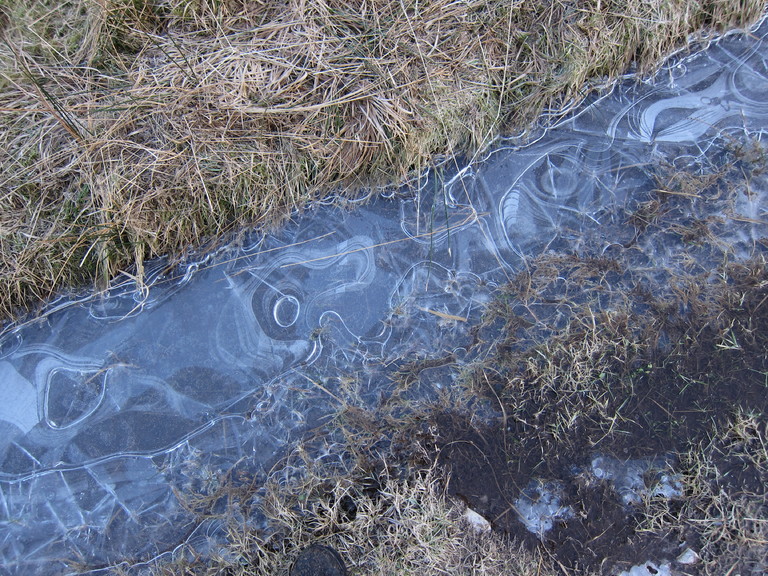 a lovely swirling pattern on the ice sheet on the track at Glen Elchaig
