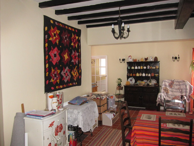 One of Jacqui's amazing quilts hangs in the dining room at White House.
